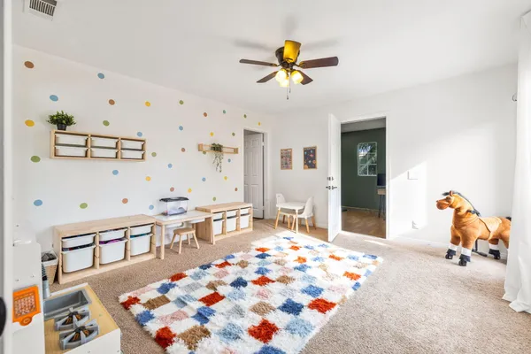 a bedroom with furniture and a chandelier