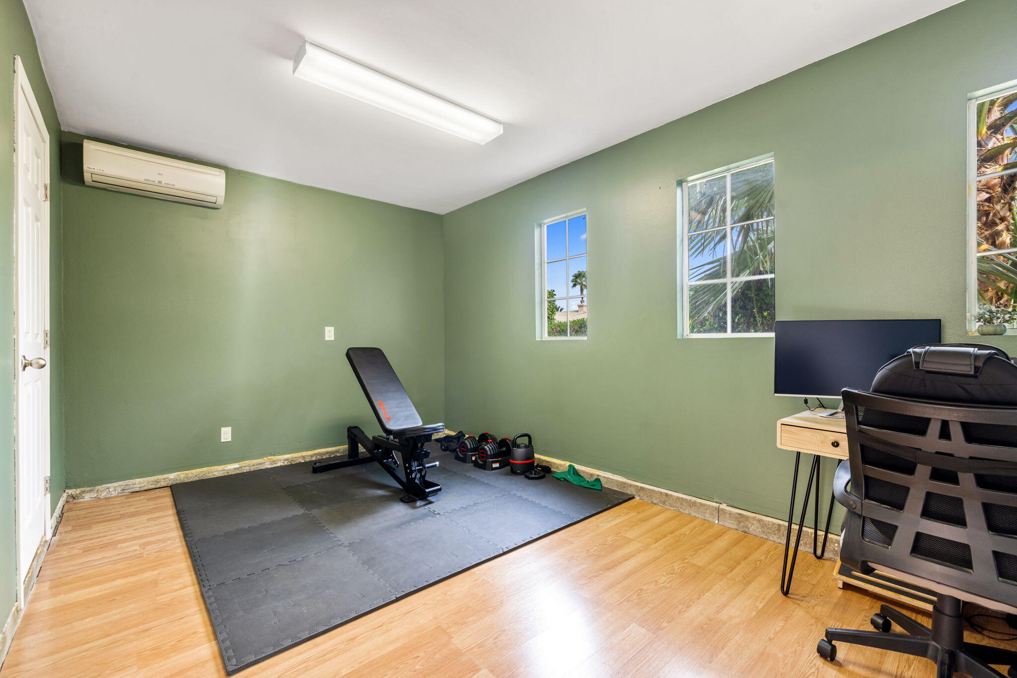 80543 Philadelphia Avenue Indio, CA 92201 - Photo 33 of 46 a room with furniture wall paintings and a window