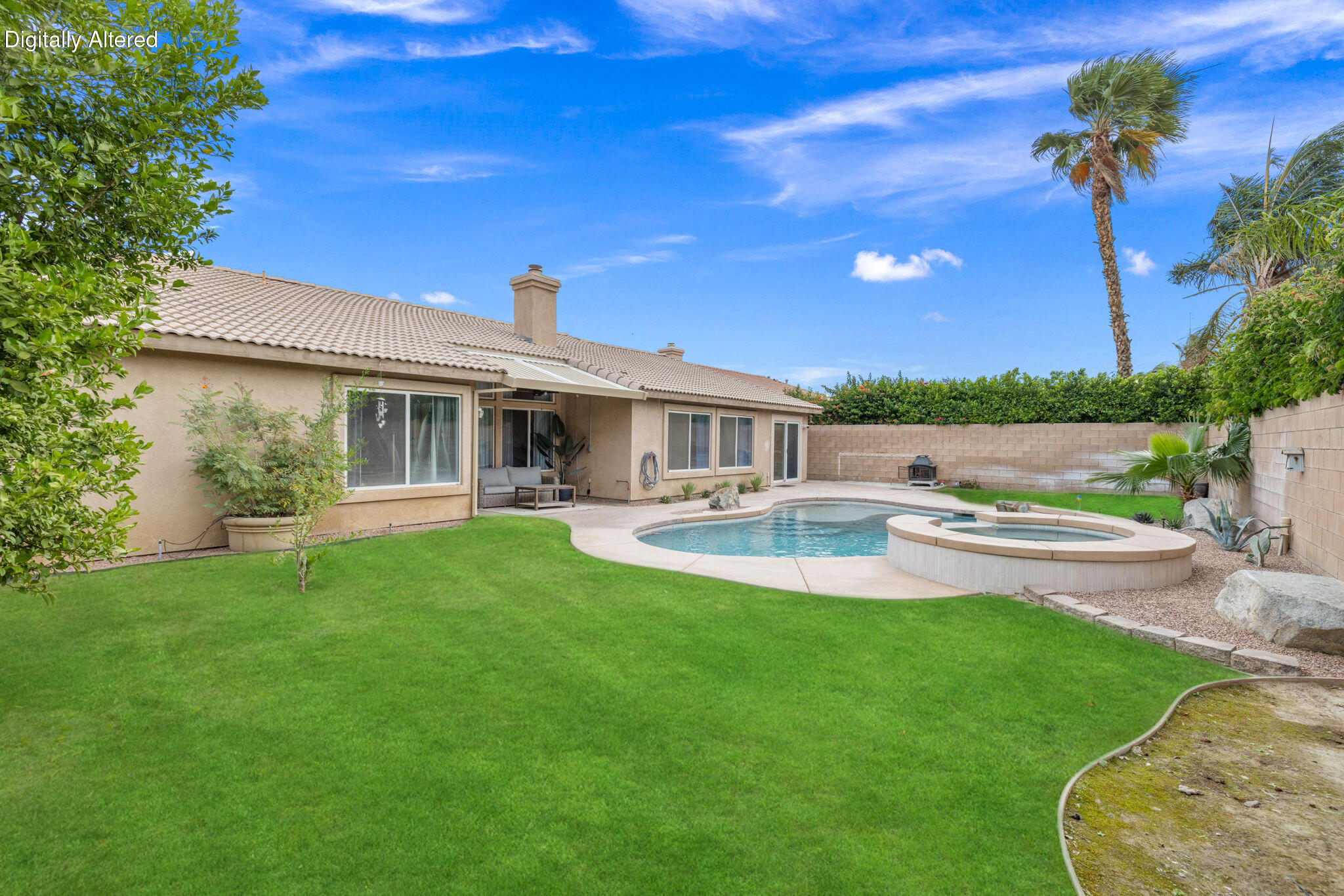 80543 Philadelphia Avenue Indio, CA 92201 - Photo 37 of 46 a view of a house with swimming pool and a yard