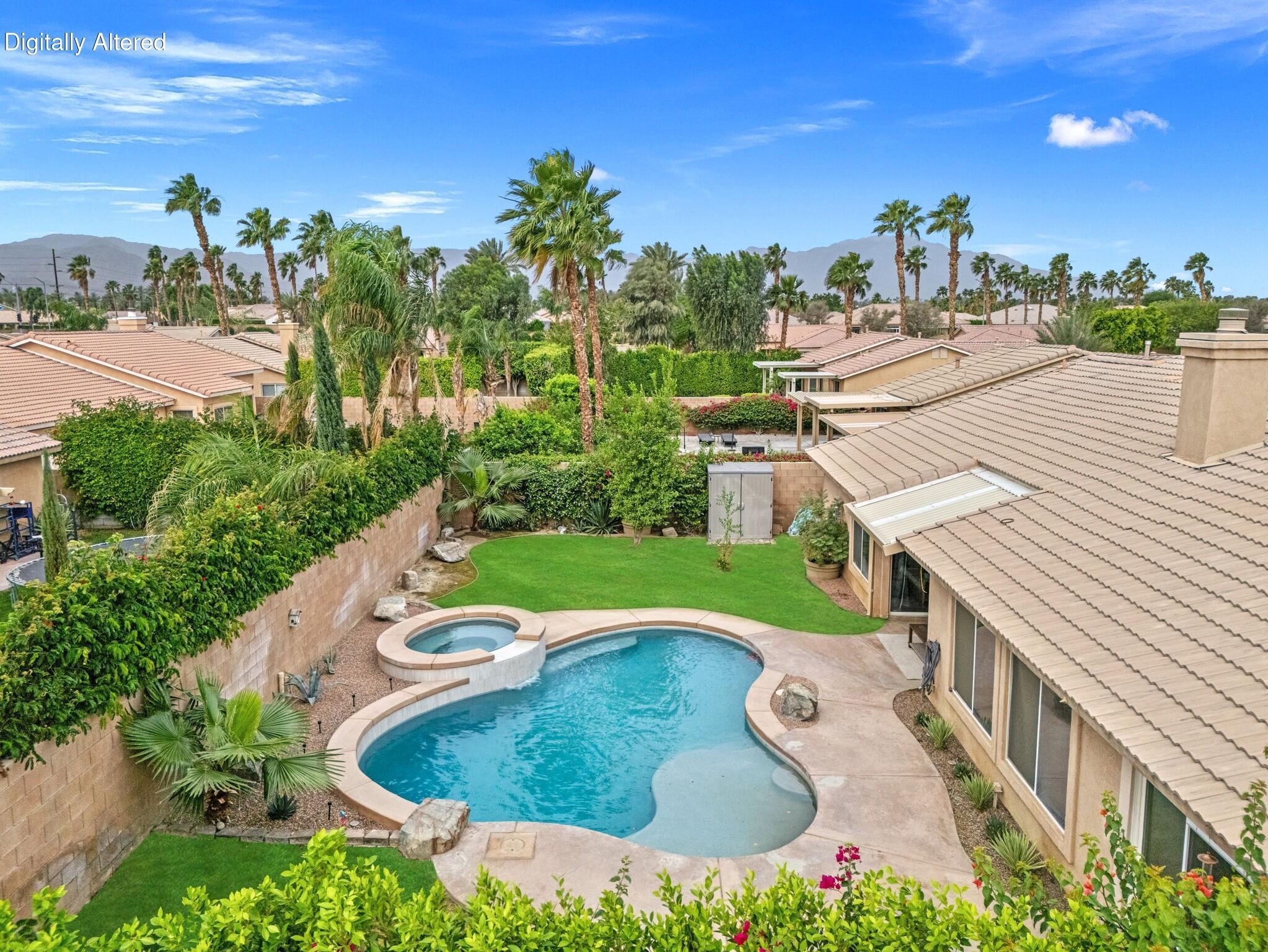 80543 Philadelphia Avenue Indio, CA 92201 - Photo 39 of 46 a view of a swimming pool with a patio