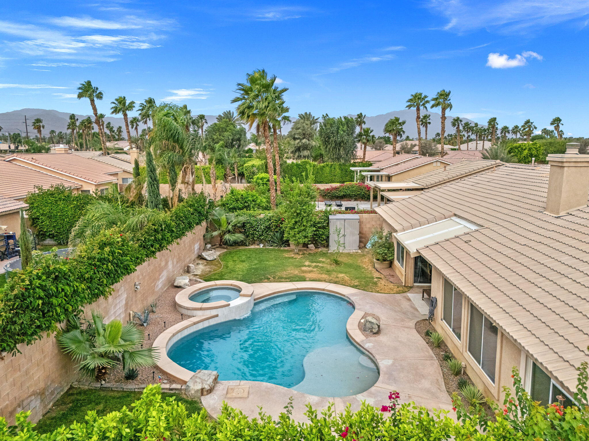 80543 Philadelphia Avenue Indio, CA 92201 - Photo 40 of 46 a view of a swimming pool with a yard