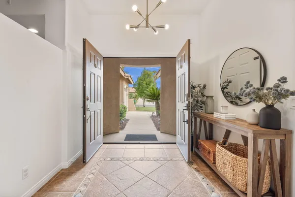 a view of an entryway with wooden floor