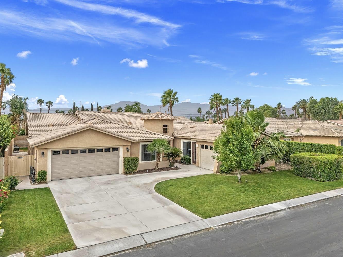 80543 Philadelphia Avenue Indio, CA 92201 - Photo 45 of 46 a front view of a house with a yard