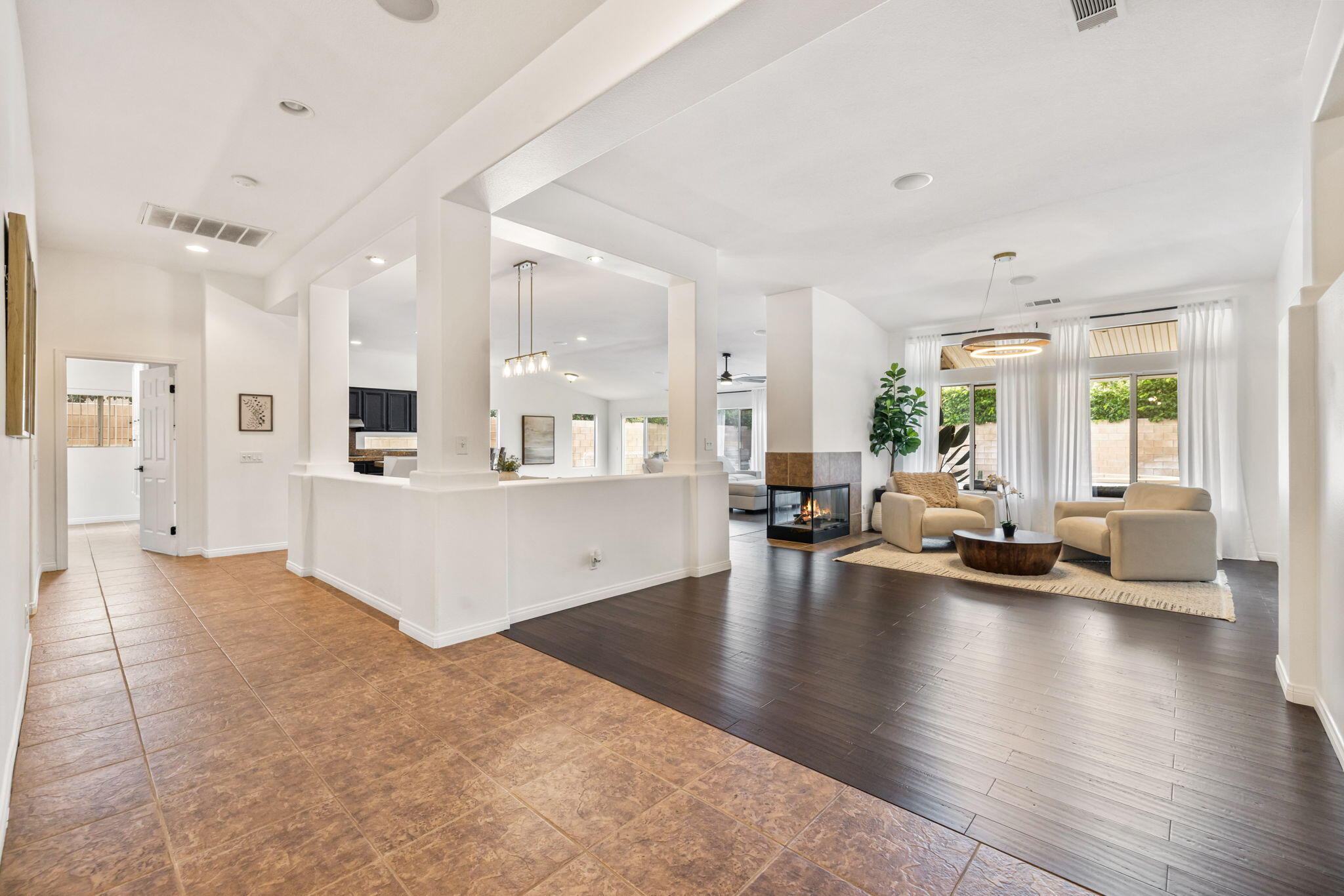 80543 Philadelphia Avenue Indio, CA 92201 - Photo 5 of 46 a large white kitchen with a large window and stainless steel appliances