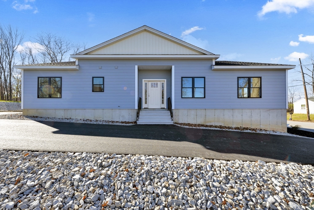 7 L Stevens Road, Unit A Charlton, MA 01507 - Photo 1 of 23 a front view of a house with a yard