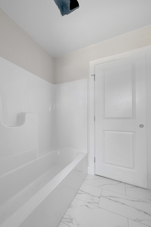 7 L Stevens Road, Unit A Charlton, MA 01507 - Photo 11 of 23 a spacious bathroom with a bathtub