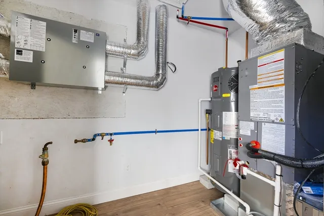 a view of storage and utility room with two washing machine