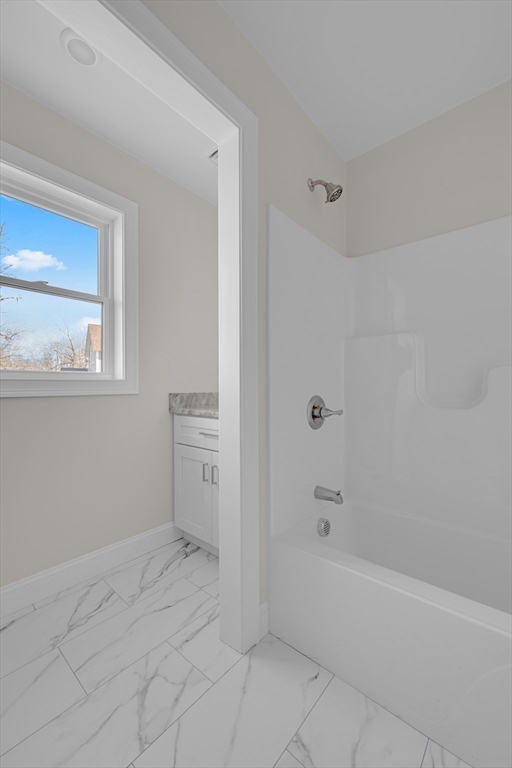 7 L Stevens Road, Unit A Charlton, MA 01507 - Photo 10 of 23 a bathroom with a bathtub and a shower