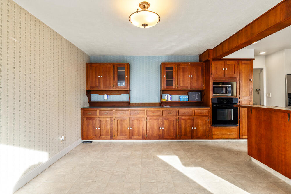 23131 North Poe Valley Road Klamath Falls, OR 97603 - Photo 17 of 45 a living room with stainless steel appliances kitchen island granite countertop a refrigerator oven a sink and dishwasher