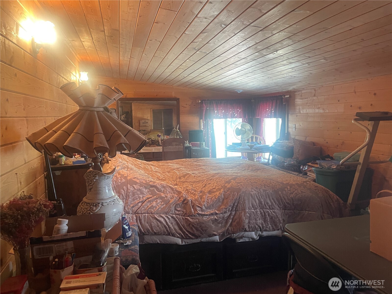 12 Caribou Road Tonasket, WA 98855 - Photo 15 of 37 a bed sitting in a room next to a window