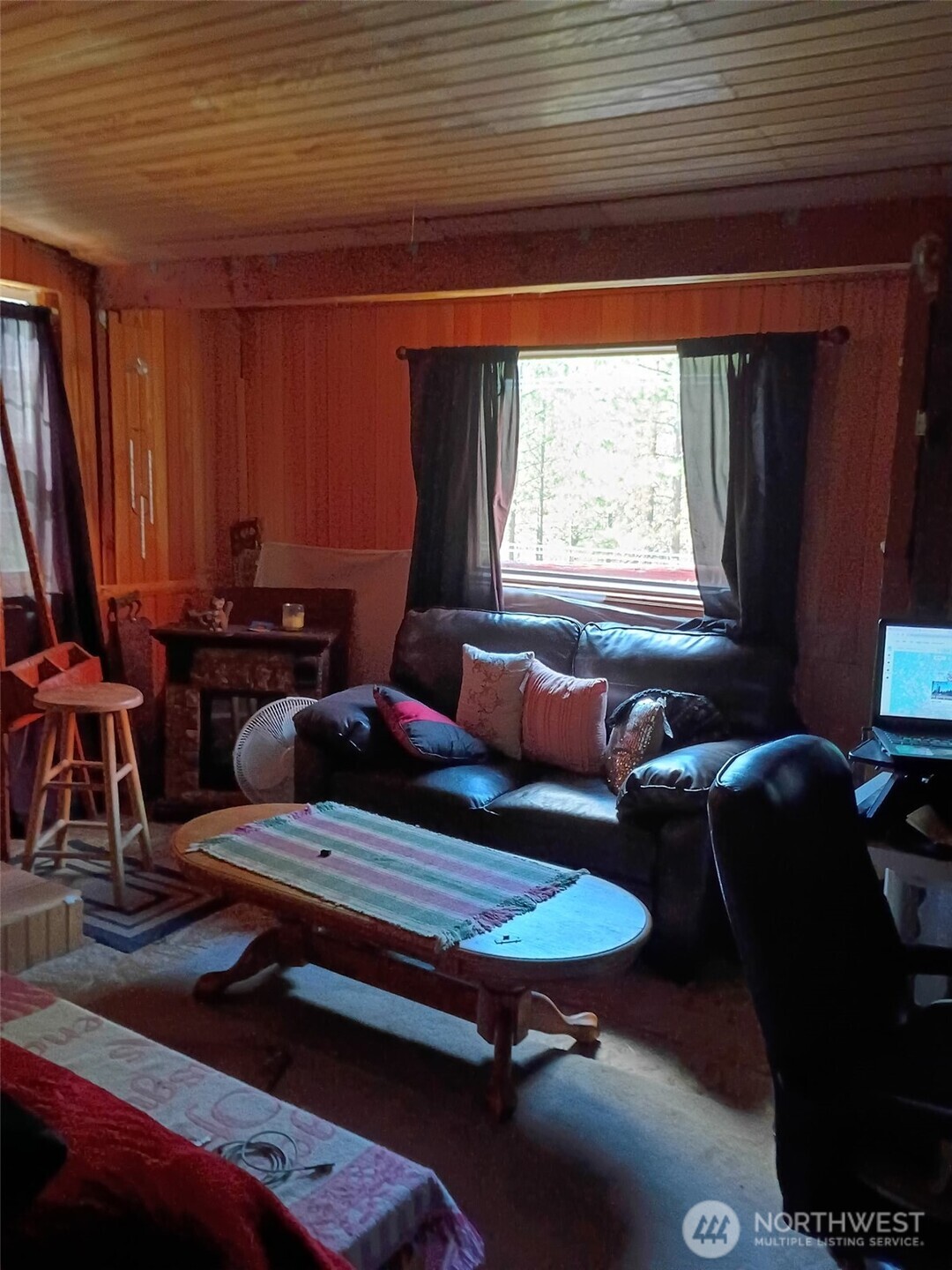 12 Caribou Road Tonasket, WA 98855 - Photo 8 of 37 a living room with furniture a window and a piano