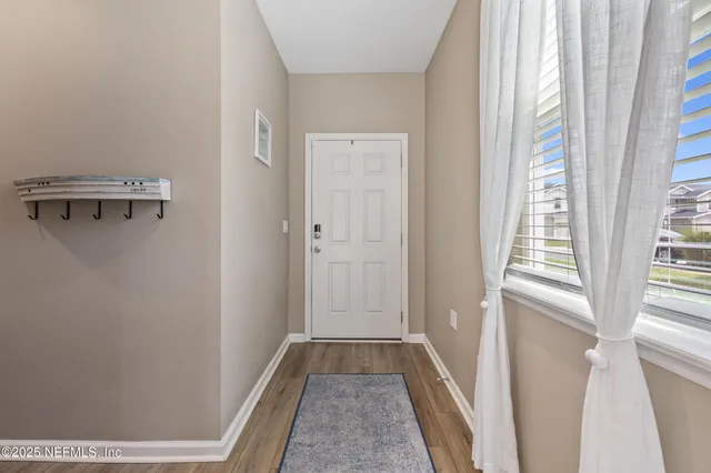 a view of hallway with windows