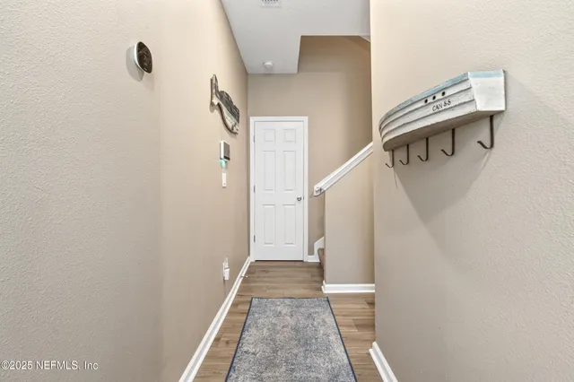 a view of a hallway with windows