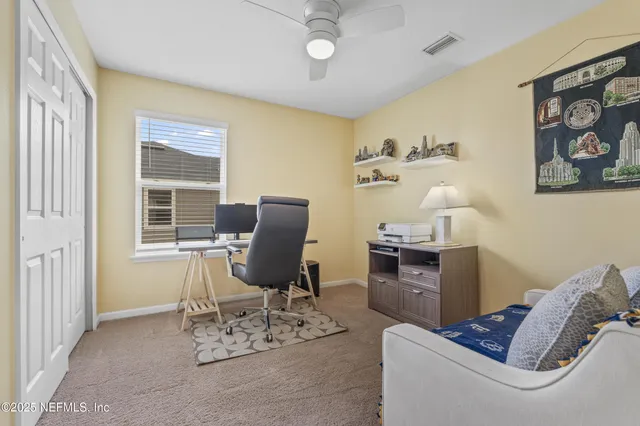 a work room with furniture and a window