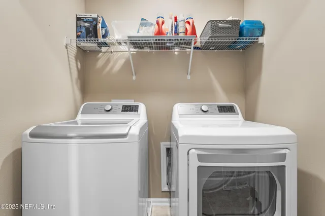 a utility room with dryer and washer