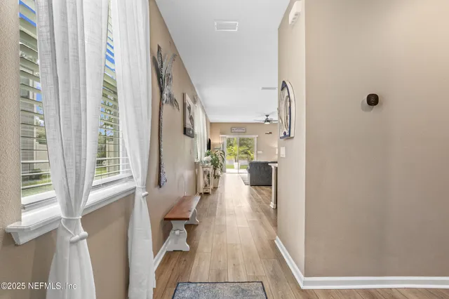 a view of a living room with a fireplace