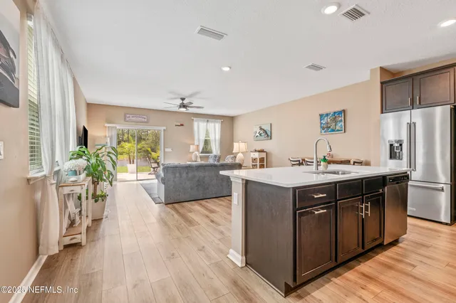 a kitchen with a sink and a refrigerator
