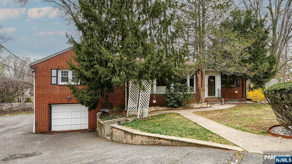 651 Alps Road Wayne, NJ 07470 - Photo 1 of 23 a view of a house with a patio