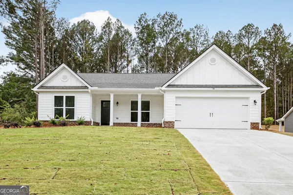 a front view of a house with yard