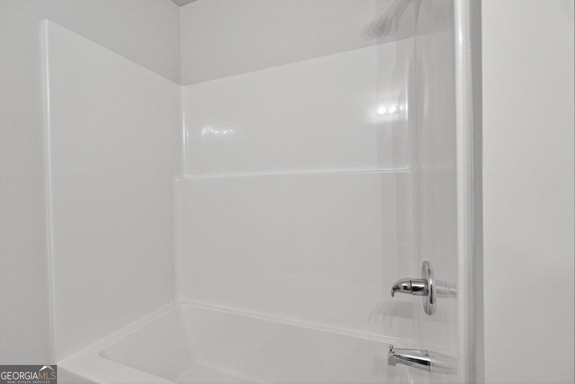 88 Mockingbird Lane, Unit 37 Winder, GA 30680 - Photo 15 of 40 a close up of a bathtub