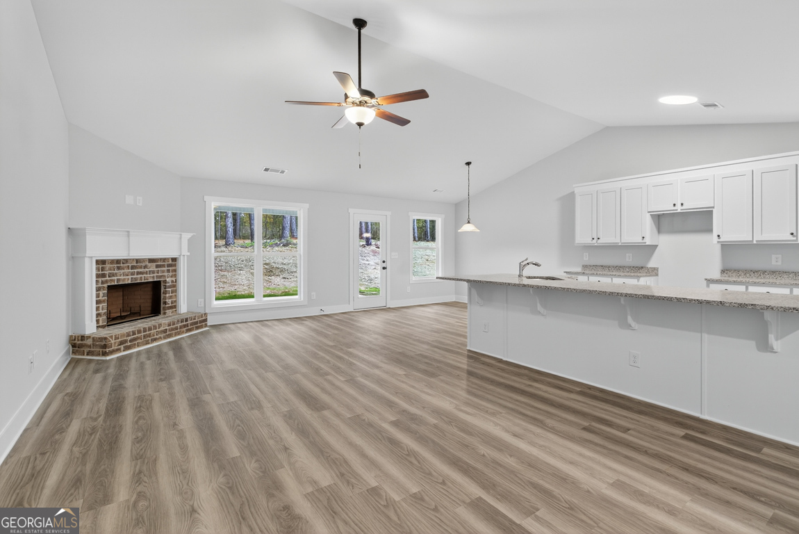 88 Mockingbird Lane, Unit 37 Winder, GA 30680 - Photo 16 of 40 a view of kitchen with granite countertop cabinets and outdoor space