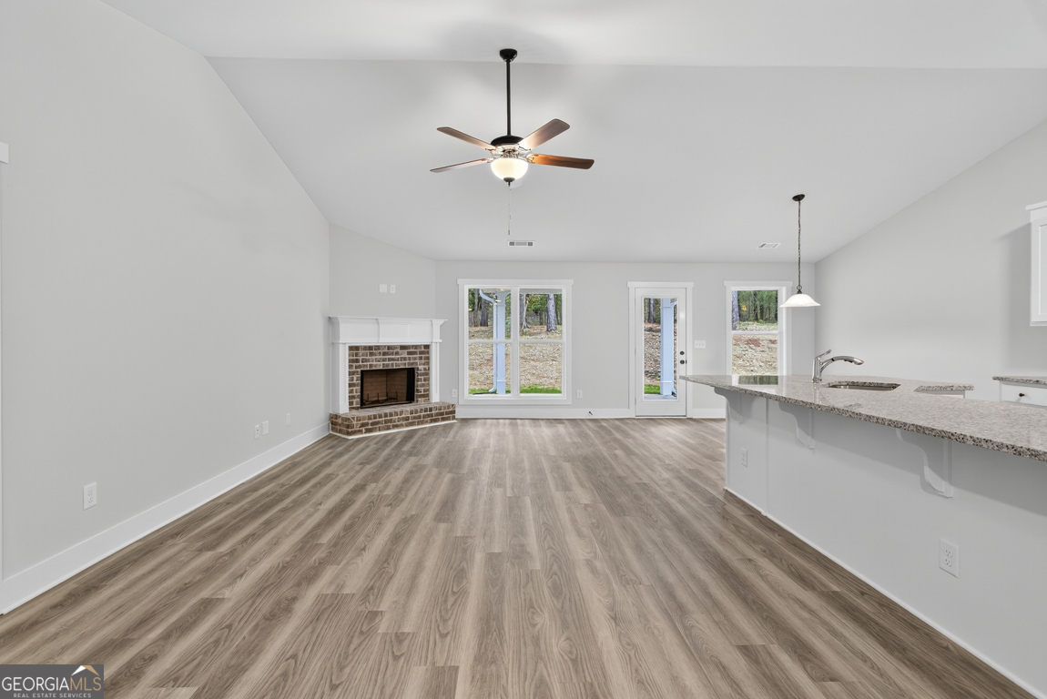 88 Mockingbird Lane, Unit 37 Winder, GA 30680 - Photo 17 of 40 a view of an empty room with a fireplace and a window