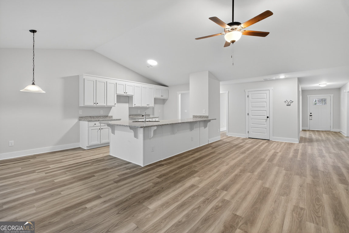 88 Mockingbird Lane, Unit 37 Winder, GA 30680 - Photo 19 of 40 a view of kitchen with granite countertop cabinets and outdoor space