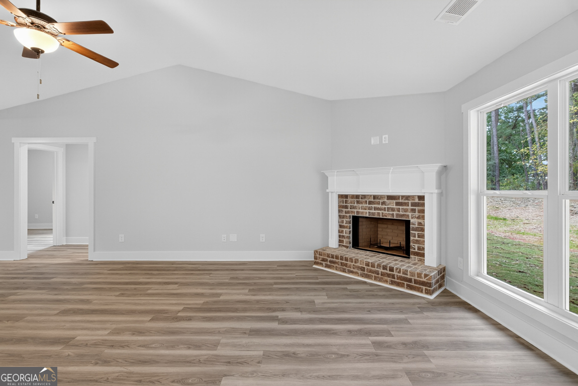 88 Mockingbird Lane, Unit 37 Winder, GA 30680 - Photo 20 of 40 a view of a livingroom with a fireplace and window
