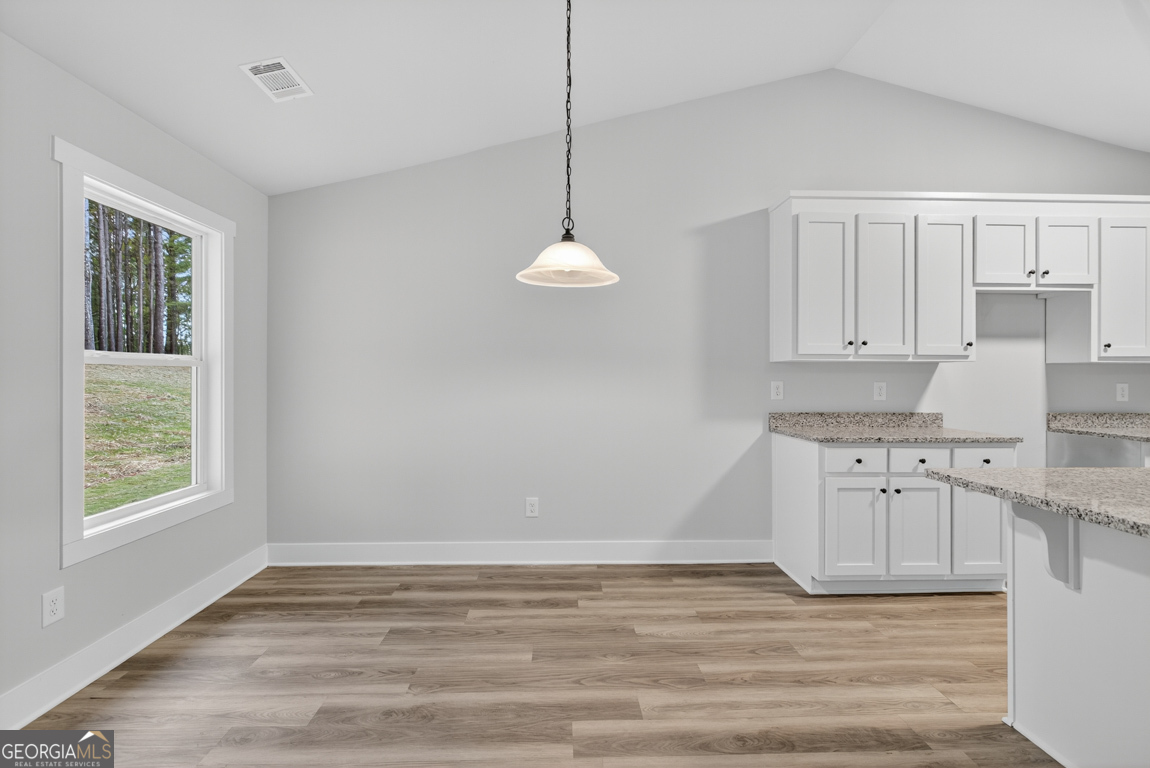88 Mockingbird Lane, Unit 37 Winder, GA 30680 - Photo 21 of 40 a view of a kitchen with cabinets appliances and a window