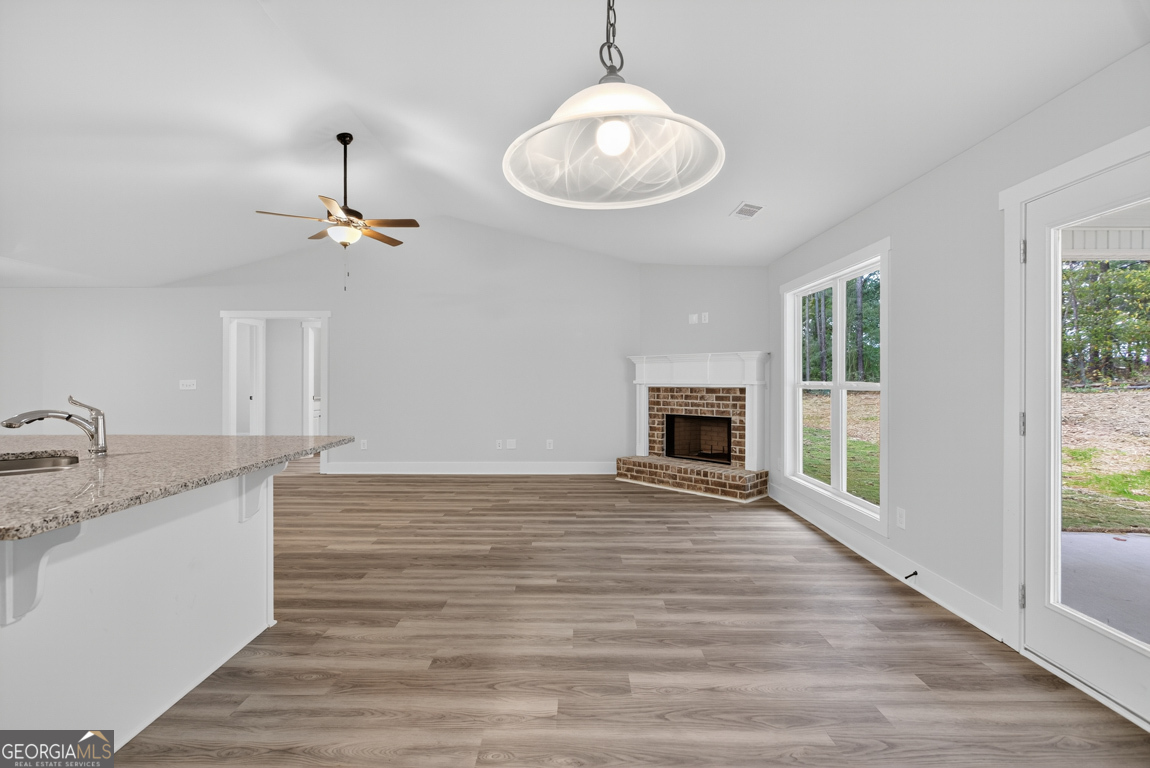 88 Mockingbird Lane, Unit 37 Winder, GA 30680 - Photo 23 of 40 a view of an empty room and window and wooden floor