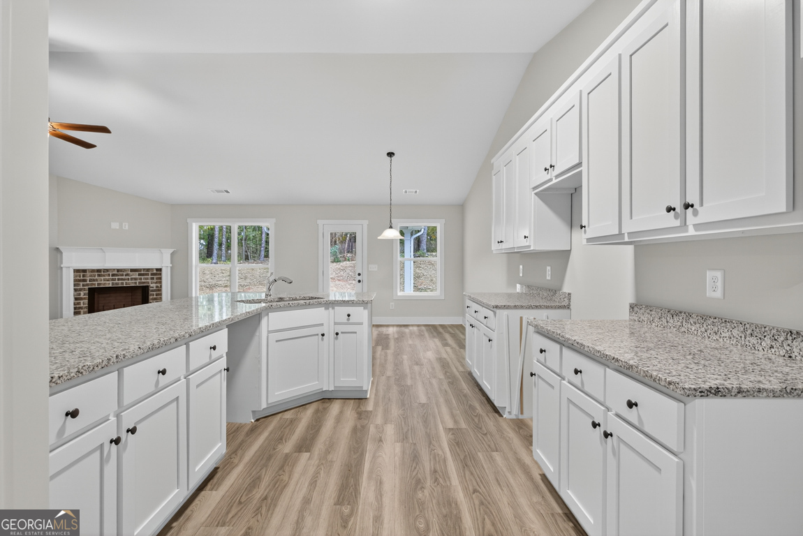 88 Mockingbird Lane, Unit 37 Winder, GA 30680 - Photo 26 of 40 a kitchen with sink stove and cabinets