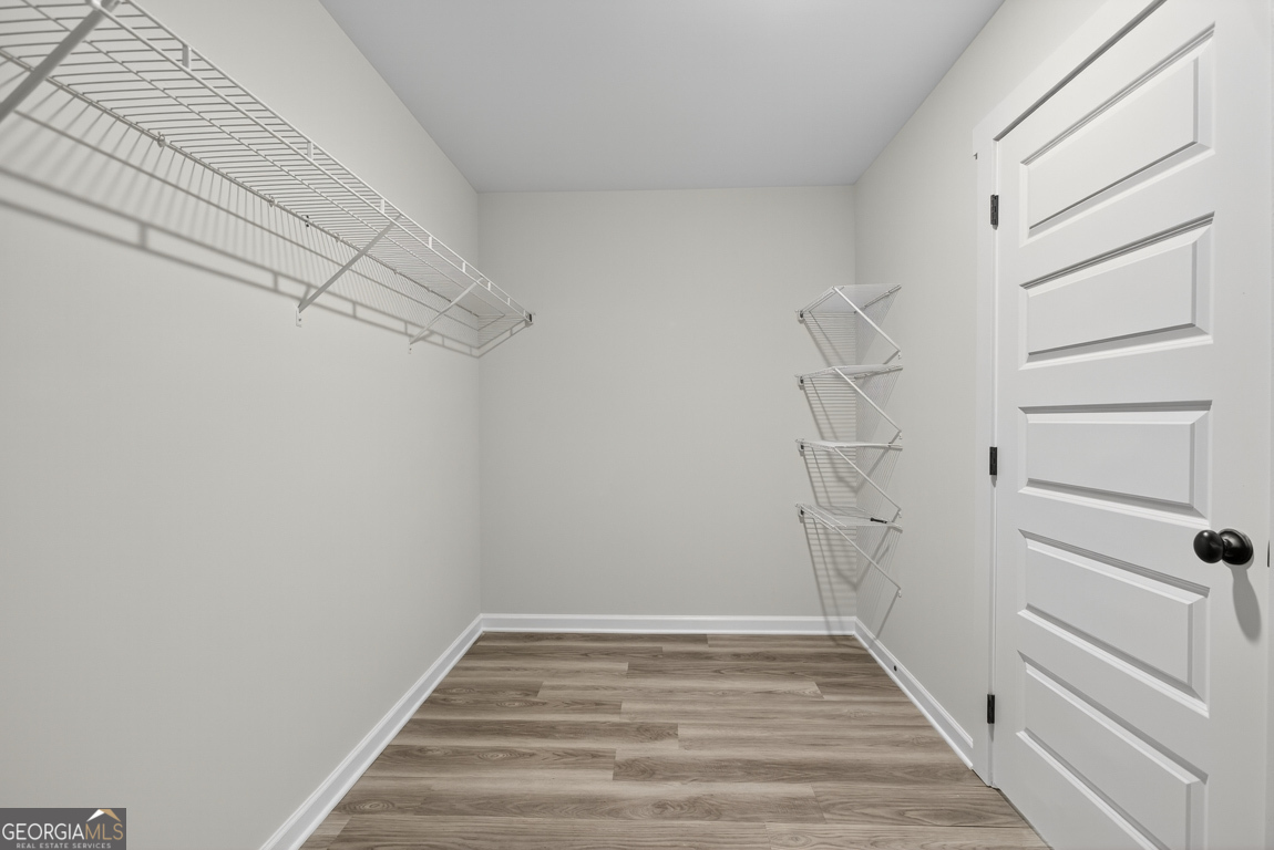 88 Mockingbird Lane, Unit 37 Winder, GA 30680 - Photo 37 of 40 a view of a room with racks on the wall