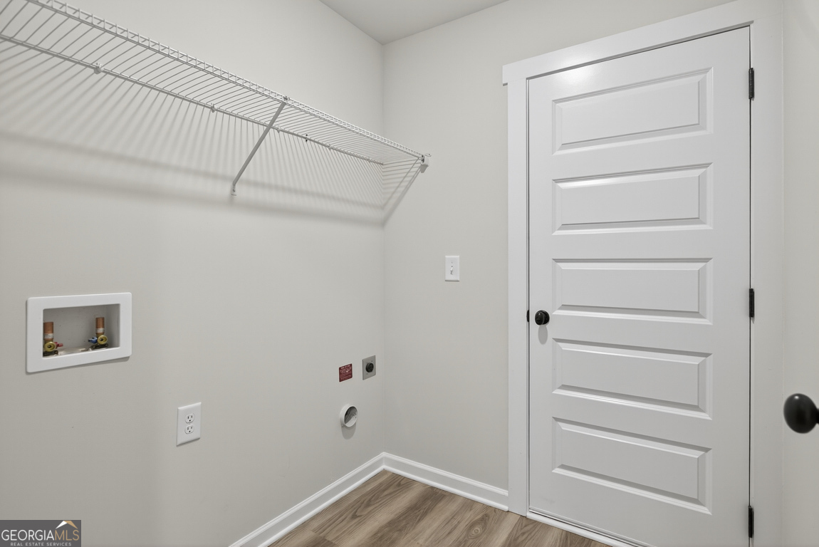 88 Mockingbird Lane, Unit 37 Winder, GA 30680 - Photo 38 of 40 a view of walk in closet with empty racks