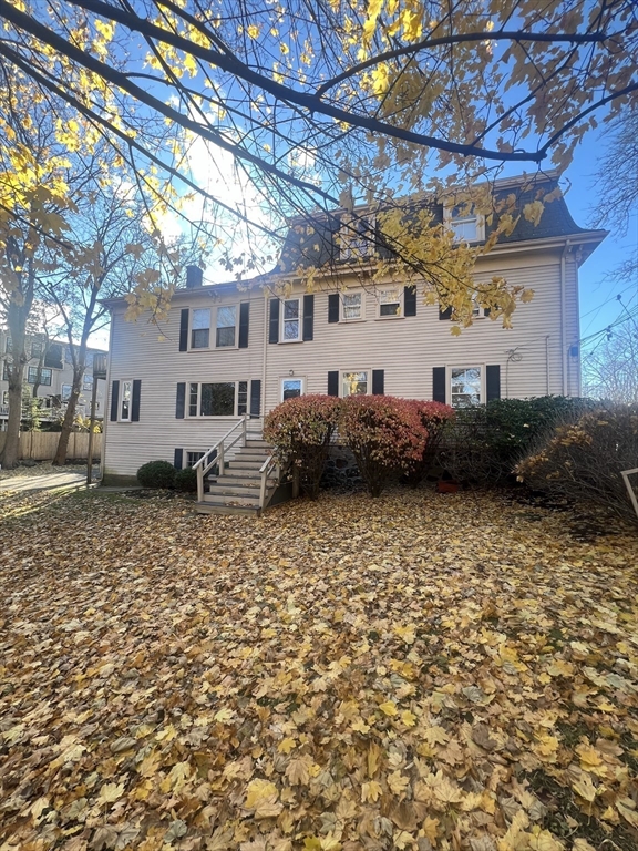 15 Harris Street, Unit 2 Marblehead, MA 01945 - Photo 18 of 19 a front view of a house with a yard