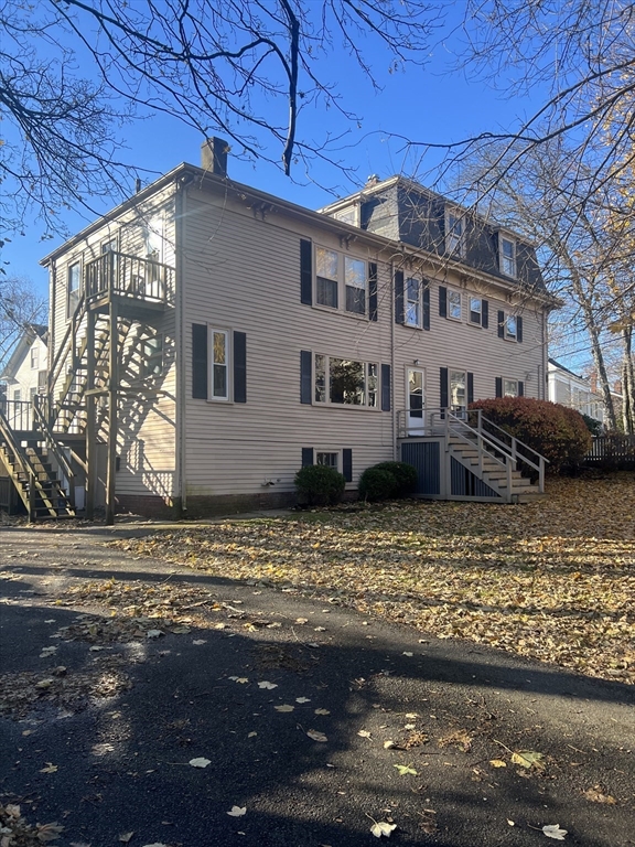 15 Harris Street, Unit 2 Marblehead, MA 01945 - Photo 19 of 19 a front view of a house with a yard