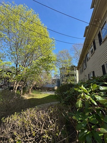 15 Harris Street, Unit 2 Marblehead, MA 01945 - Photo 3 of 19 a view of a yard with plants and large trees