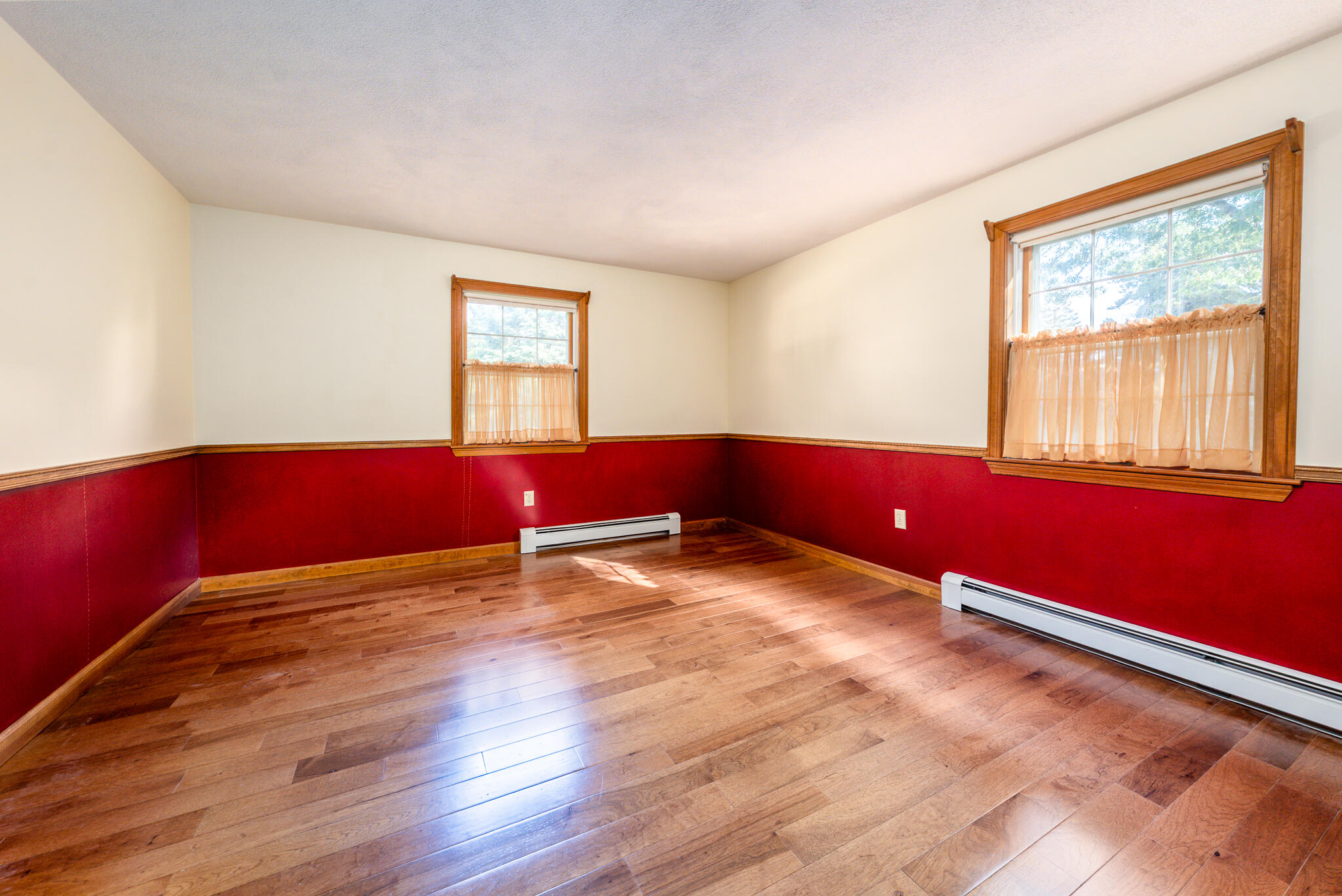 115 Sparrow Hawk Lane Eastham, MA 02642 - Photo 11 of 30 a view of empty room with wooden floor and fan