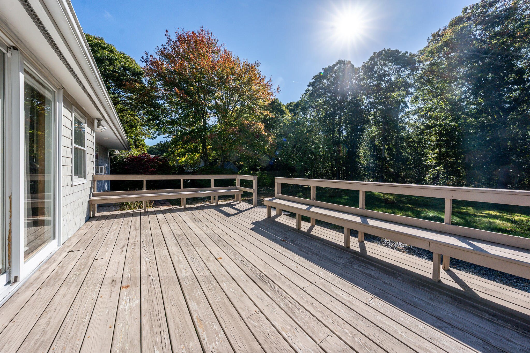 115 Sparrow Hawk Lane Eastham, MA 02642 - Photo 20 of 30 a view of balcony with wooden floor and fence