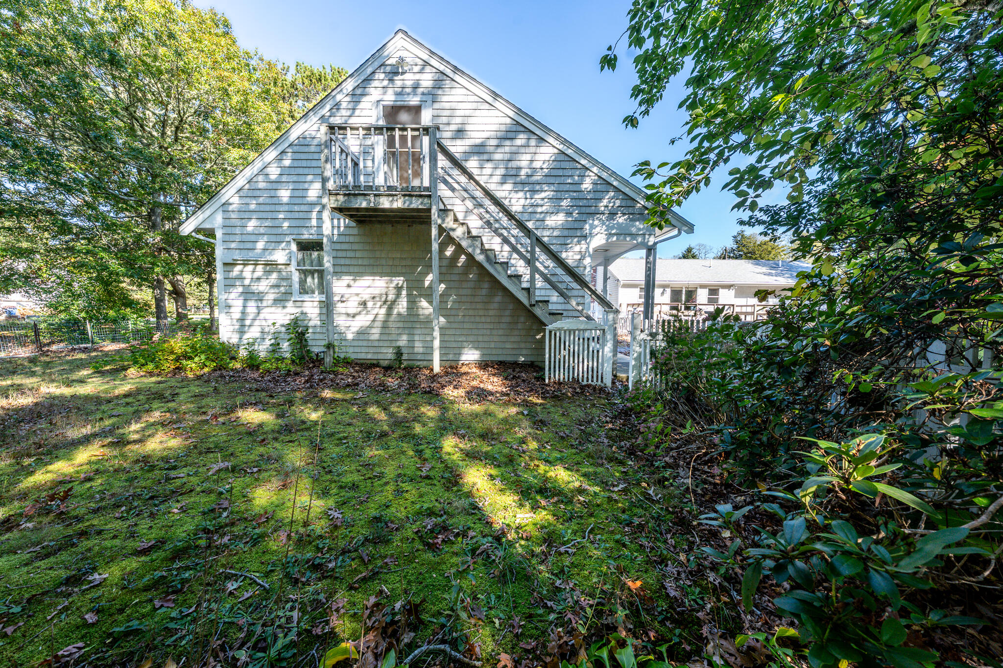 115 Sparrow Hawk Lane Eastham, MA 02642 - Photo 27 of 30 a view of a house with large tree
