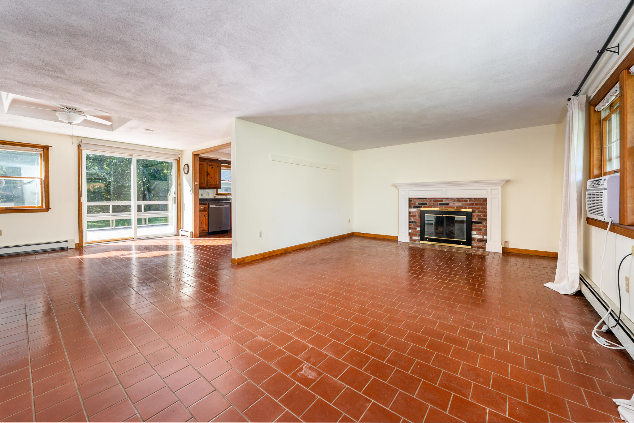 115 Sparrow Hawk Lane Eastham, MA 02642 - Photo 4 of 30 an empty room with windows and fireplace