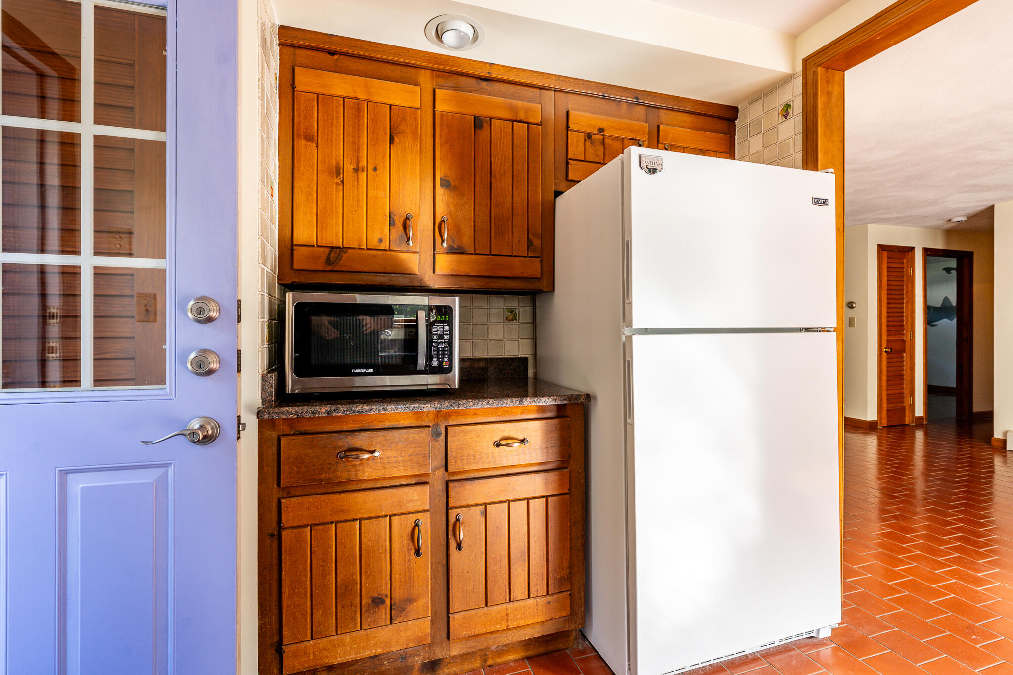 115 Sparrow Hawk Lane Eastham, MA 02642 - Photo 7 of 30 a white refrigerator freezer and a stove sitting inside of a kitchen