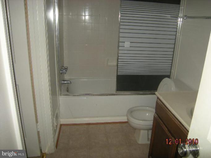 6947 Mayfair Terrace Laurel, MD 20707 - Photo 4 of 5 a bathroom with a toilet and a shower