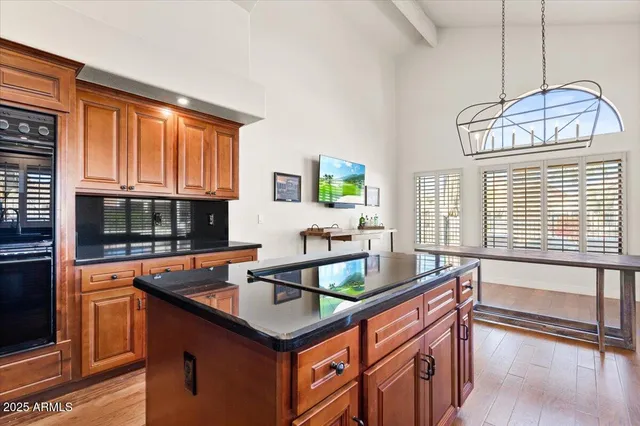 a kitchen that has a sink and a large window in it