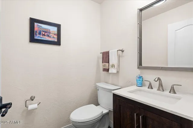 a bedroom with a bed and lamp