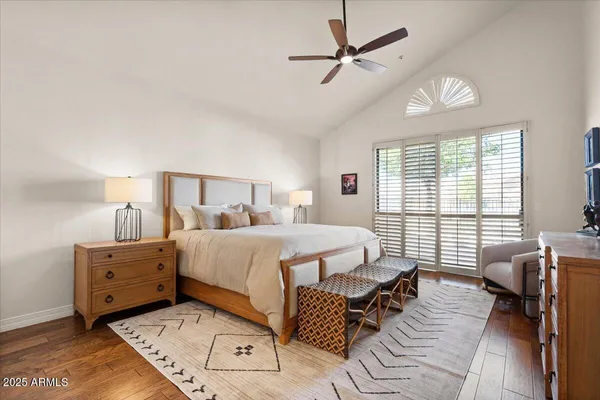 a bedroom with a bed and dresser