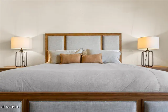 a bedroom with bed and a couch