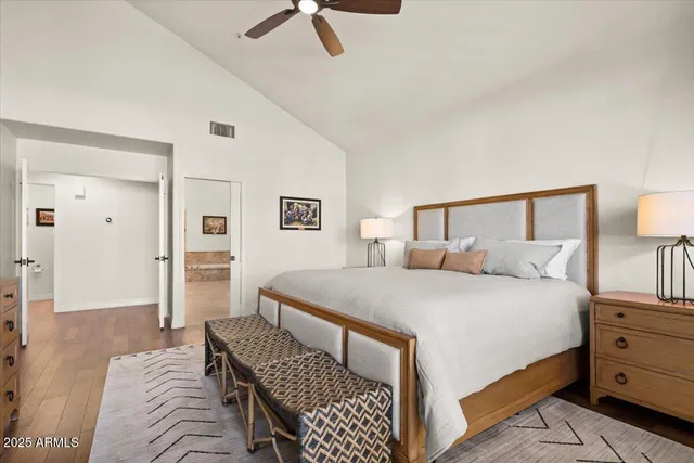 a living room with furniture a couch and a flat screen tv