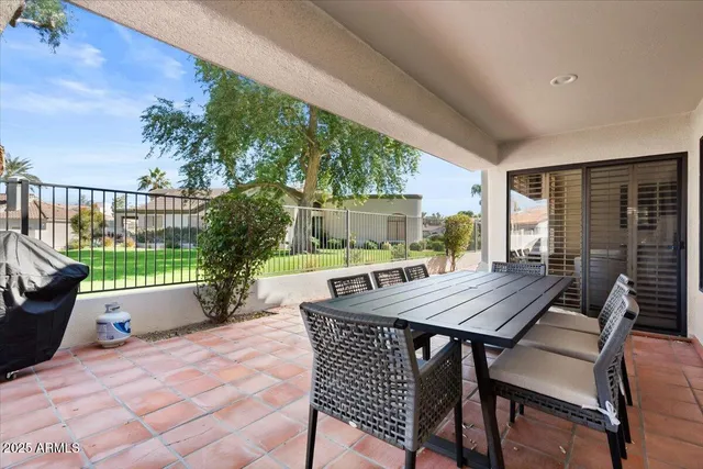 a view of two chairs in the balcony