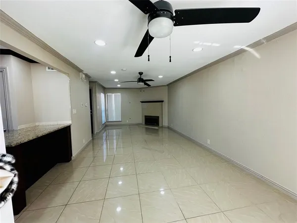 a view of an empty room with a fireplace