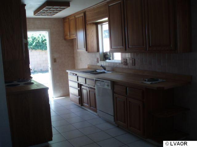 4148 Constellation Road Lompoc, CA 93436 - Photo 5 of 7 a kitchen with a sink and a window